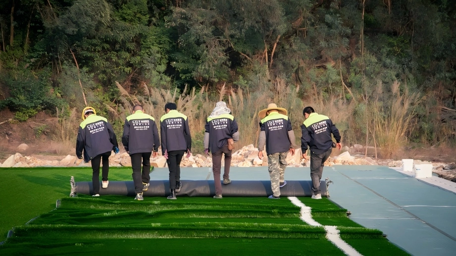 Artificial turf installation process for professional football field construction