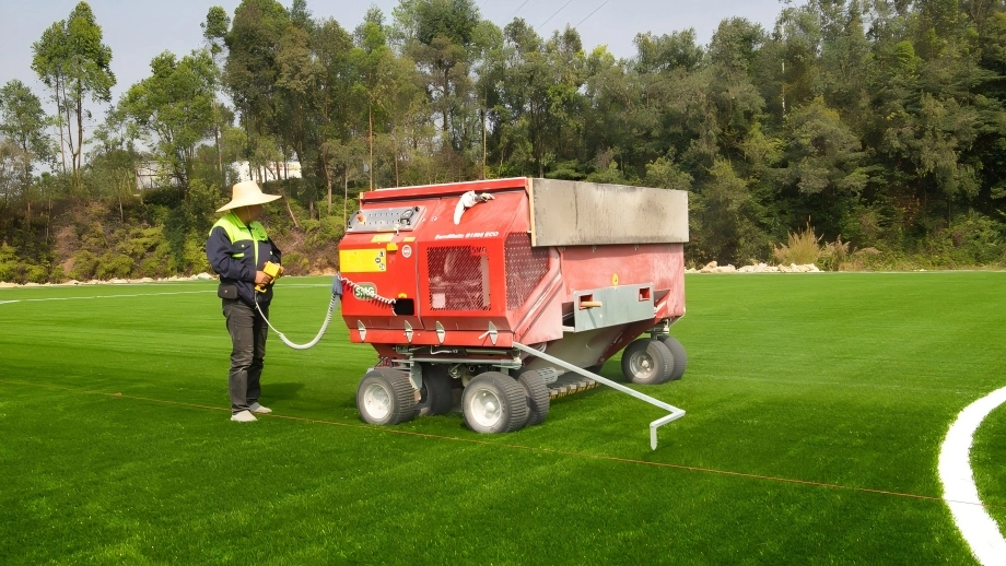 Infill application during artificial football pitch installation process